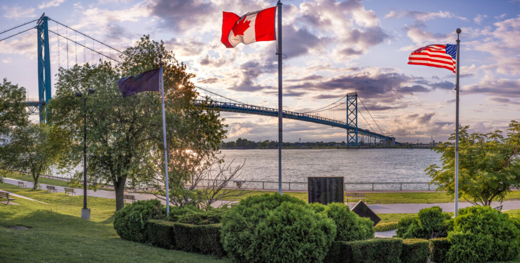 Canada and U.S. flags at border