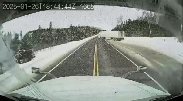 A truck drives onto the highway