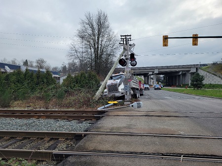 Picture of a dump truck that crashed into utility poles